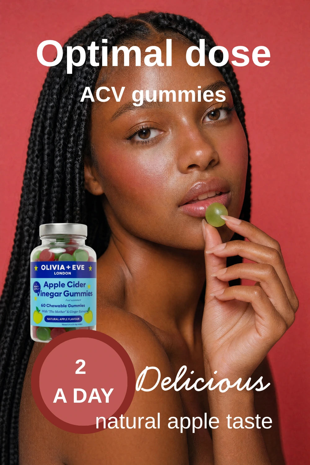 Woman holding a gummy with a bottle of ACV gummies labeled 'Olivia + Eve' on a red background.