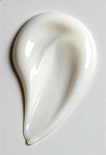 White ceramic spoon rest on a light gray background