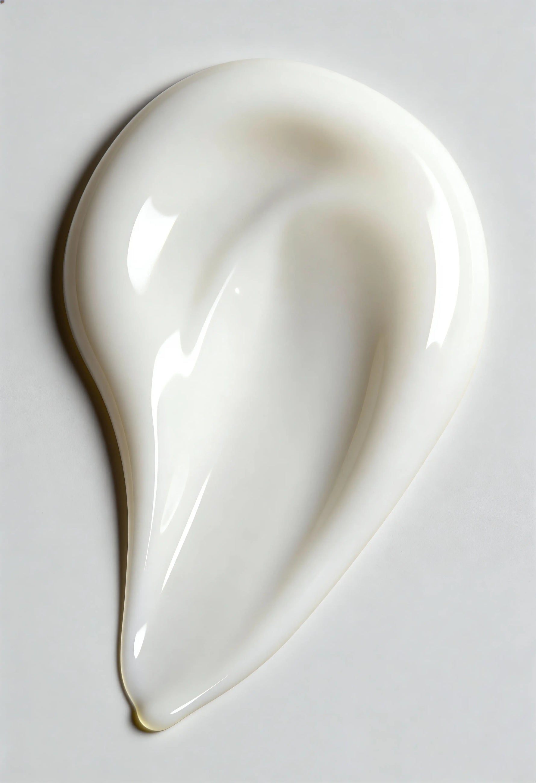 White ceramic spoon rest on a light gray background
