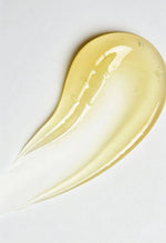 Yellow serum smear on a white background