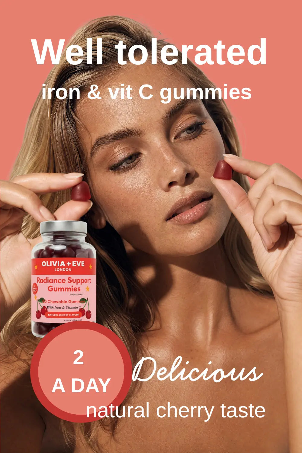 Woman holding iron and vitamin C gummies with product packaging on a peach background