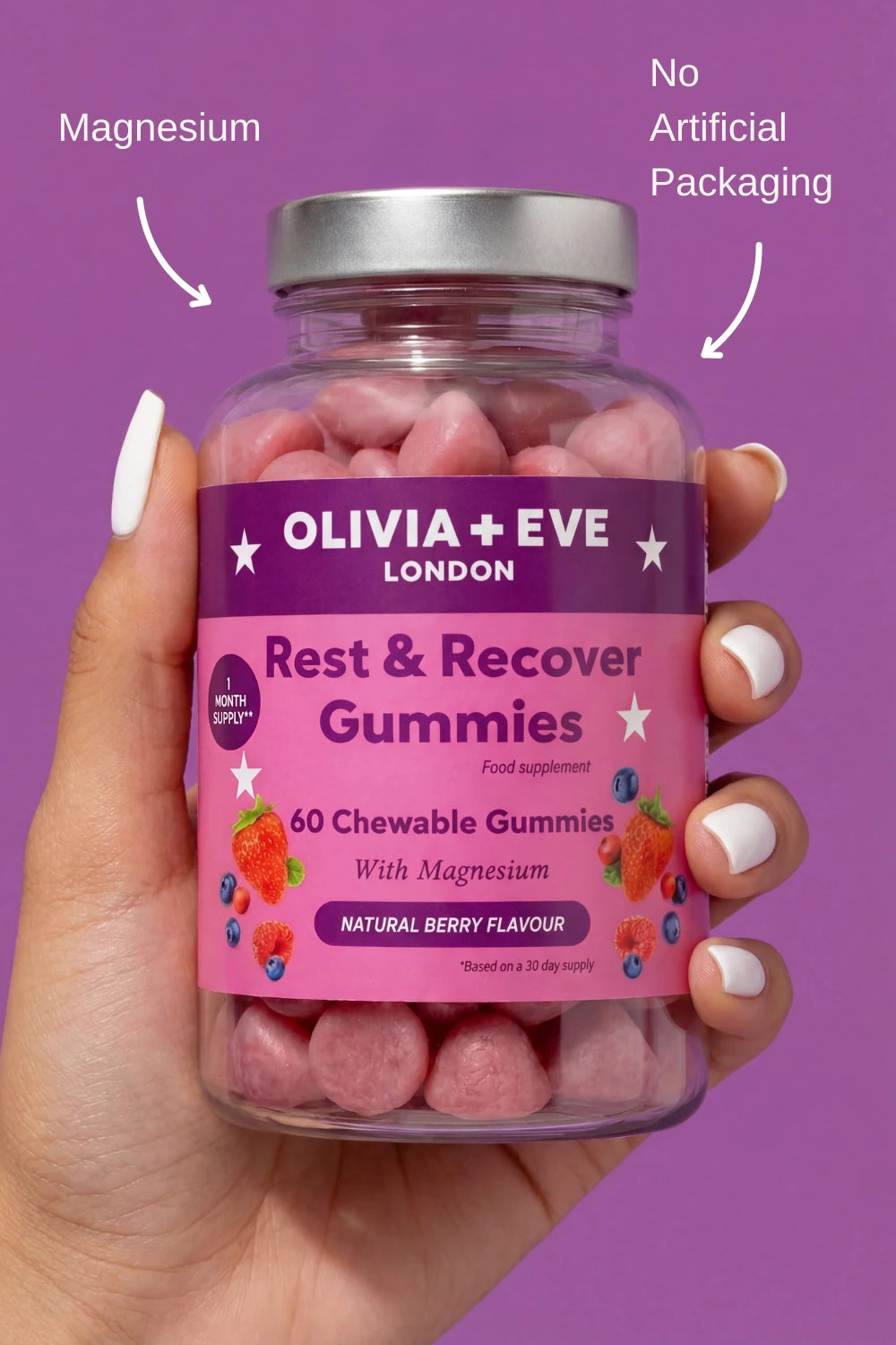 Hand holding a bottle of Olivia + Eve Rest & Recover Gummies against a purple background