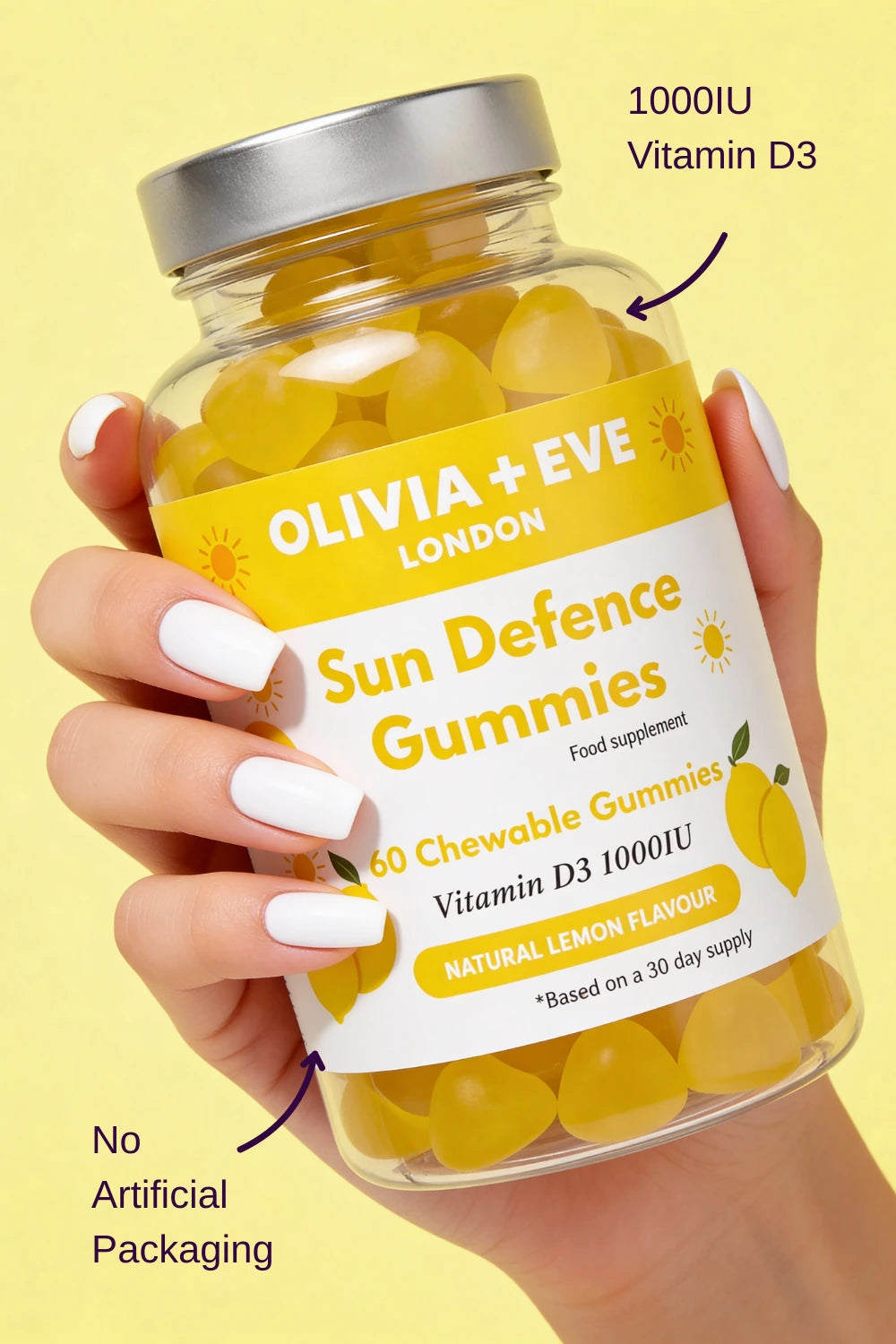Hand holding a bottle of Olivia + Eve Sun Defence Gummies with lemon flavor on a yellow background