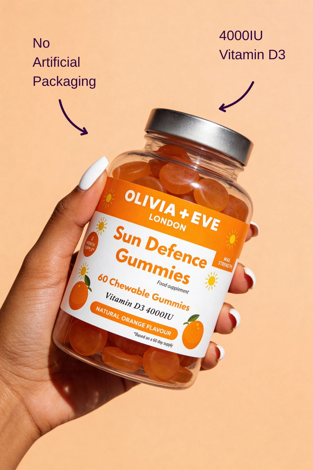 Hand holding a jar of Olivia + Eve Sun Defence Gummies with an orange background